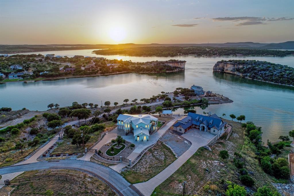 COASTAL VIBE ESTATE ON THE ONLY PRIVATE SANDY BEACH INSIDE LANDMARK HELLS GATE!  Pull up in your yacht and jump out onto private sandy beach with huge, covered shoreline cabana. Wide concrete driveway up to multilevel estate with room for future pool next to lovely cabana with more gorgeous views. Inside, two huge living areas with kitchens, bedroom suites, large outdoor living spaces ON SEPERATE FLOORS.  Excellent floorplan to entertain guests while enjoying complete privacy. INSIDE ELEVATOR! Top grade appliances & exotic granite islands Two Master suites w lux bathrooms. Lovely library, double bunk room, gym equipment w view. Turnkey NEW PRO COSTAL DECOR, fine art, luxury furnishings. Solid white oak herringbone floors, glass & porcelain tile, extensive woodwork & moldings throughout plus 3 fireplaces. Sleeps 16 or more, 4 garages, fenced, circular drive, iron gates. Community amenities & airport. VRBO? YES, and First Class Marina close-by VISIT HellsGateLuxuryBeachHouse. c o m