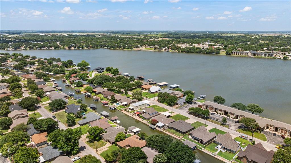 If you have been looking for a great waterfront home or a lake retreat to host a STR, look no further!  This value priced home is ready for fun and sun.  During the off season, update this place, it could be a show stopper!  With 3 bedrooms, 2 bathrooms and a garage that could be turned into a bunk room or game room, there are plenty of places for overnight guests.  There is an also a huge sunroom that looks out onto the water and the boat dock.  The neighborhood is very safe and convenient to Home Depot, Lowes and the historic square.  As an added benefit, watch the awesome fourth of July fireworks from your back yard.  Home has newer septic, and all new carpet.
