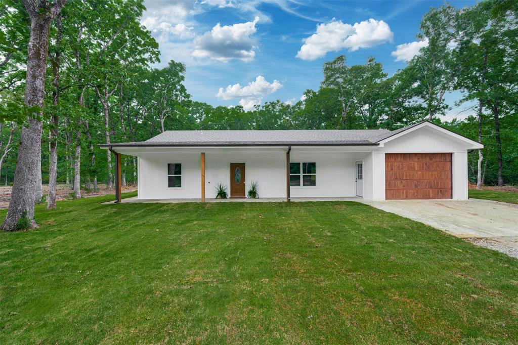 Stunning new construction situated on over an acre in highly desirable Lamar County, surrounded by beautiful, mature trees that provide both privacy and a peaceful setting. This 3-bedroom, 2.5-bath home offers exceptional curb appeal with inviting covered porches on both the front and back—perfect for enjoying the natural surroundings.

Inside, you’ll find a thoughtfully designed open floor plan with quality craftsmanship and attention to detail throughout. The spacious living area flows seamlessly into the kitchen and dining spaces, creating an ideal layout for both everyday living and entertaining.

Step outside to a private, fenced backyard featuring a gazebo with a metal roof—an ideal space for gatherings, relaxing evenings, or hosting guests year-round.

With its secluded location, beautiful setting, and quality construction, this home offers the perfect blend of comfort, style, and privacy. Don’t miss this exceptional opportunity in Lamar County.