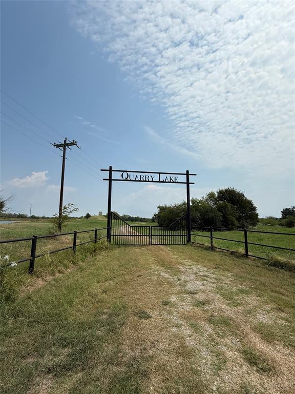 Located in the gated Quarry Lake community, this rare 4± acre lakefront lot offers direct access to a private, residents-only lake. The property provides multiple building options with space for a custom home and outdoor living areas. Quarry Lake features a gated entrance, established roads, underground utilities, and design standards that maintain the quality of the neighborhood. This is a rare opportunity to secure a premier lot with water frontage in a private, well-planned subdivision. Must see this property in person to appreciate it.