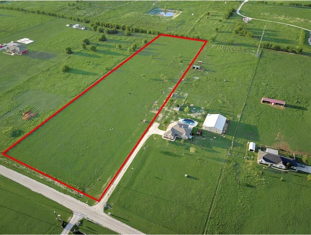 Welcome to your dream property! These 5 acres have amazing views - rolling hills for your future front porch and privacy in your backyard. Build your dream home in an established community. This property has lots of possibilities. Bring your own builder- and build within your own timeframe.
Frontage Road has the culvert already built.  Electricity is running along the road. The septic system is needed. Frontage contains a barbed wire fence, Left and back sides are pipe fences.
