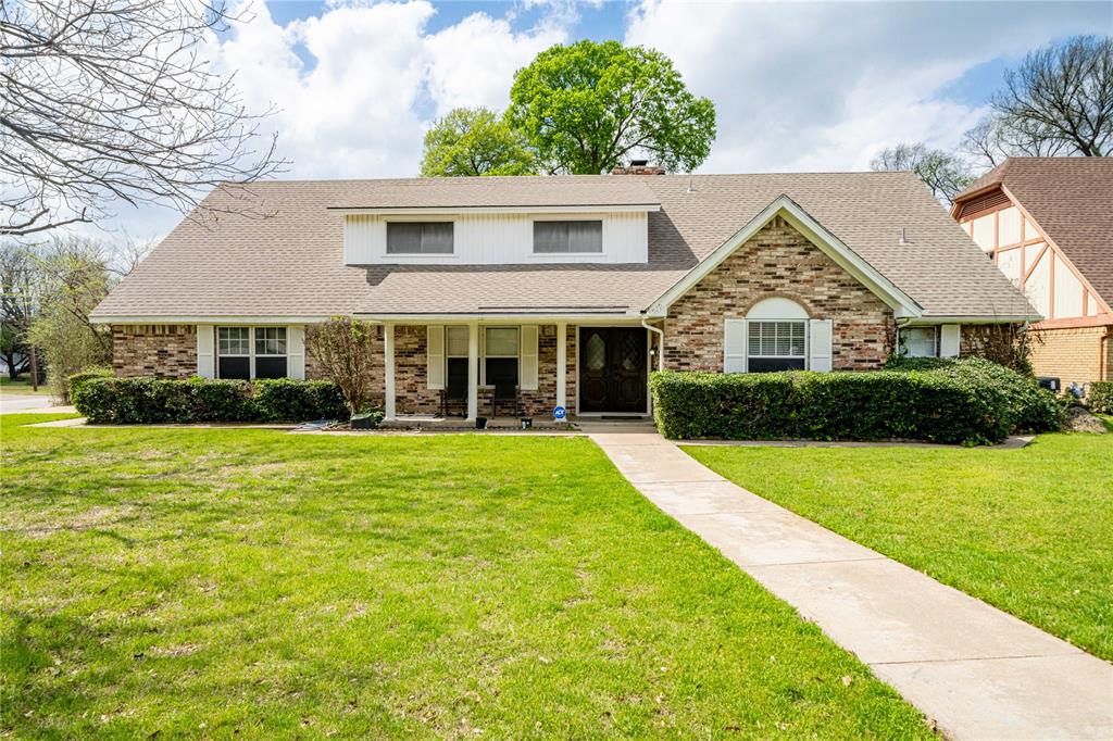 Located in a serene, tree-lined established neighborhood, this character rich 5-bedroom, 3.5-bath home sits on a desirable corner lot and offers exceptional indoor and outdoor living. A charming covered front porch welcomes you inside to an open and bright floor plan. Just off the entry, a dedicated home office with custom built-in shelving sits across from a versatile flex room, both flowing seamlessly into the spacious open-concept kitchen. The kitchen features white cabinetry, abundant counter space, and stainless steel appliances, with a cozy breakfast nook offering built-in cabinetry and peaceful views of the backyard. The living room is a showstopper, with a brick-faced fireplace, soaring vaulted ceilings with exposed wood beams, and expansive floor-to-ceiling windows that flood the space with natural light. Picture frame molding adds a refined, classic touch throughout. The primary suite is located on the main level and features French doors leading to the backyard. The recently renovated en-suite bath features dual sinks, a spacious jetted soaking tub, a sleek frame-less glass shower, and double walk-in closets. All additional oversized bedrooms are upstairs offering ultimate privacy and built-in shelving and flexible layout options. Step into your private outdoor oasis—featuring a covered patio that opens to a stunning, sparkling in-ground gunite pool. Enjoy evenings by the cozy fire pit or relax under the charming gazebo, all within the privacy of a fully fenced backyard. Additional highlights include a brand-new roof and a new downstairs AC unit, offering peace of mind and energy efficiency for years to come. Perfectly situated just minutes from Joe Pool Lake and Cedar Ridge Preserve, with easy access to parks, playgrounds, shopping, dining, and major highways for a quick commute. Don’t miss this incredible opportunity to own a home that truly has it all! 100% FINANCING AVAILABLE and NO CLOSING COST OPTIONS!