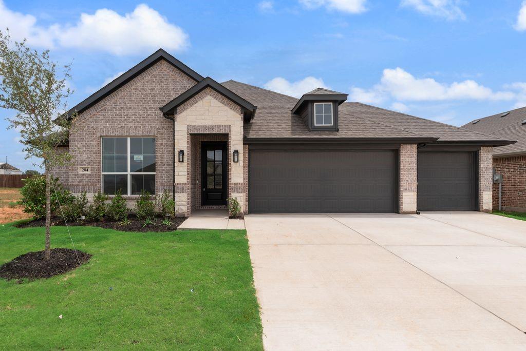 MLS# 21181325 - Built by Risewell Homes - Ready Now! ~ This beautifully designed home in Granbury offers a spacious, modern layout that blends comfort, functionality, and everyday livability. The open-concept kitchen, family room, and breakfast nook create a bright, connected living space perfect for both entertaining and daily life, featuring a large island, seamless flow into the family room, and a cozy fireplace that anchors the space. The private primary suite is thoughtfully positioned for comfort and privacy, offering a generous bedroom, a well-appointed ensuite bath, and a large walk-in closet. Three additional bedrooms and a full bathroom provide comfortable accommodations for family or guests. With a covered patio for outdoor living, a welcoming front porch, a functional utility room, and a spacious three-car garage, this home delivers smart design, flexibility, and timeless appeal in a layout built to truly live well.