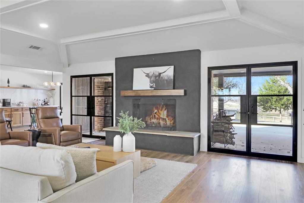 Welcome to this meticulously remodeled home, offering unparalleled privacy and tranquility, nestled among 30 mature pecan trees on a picturesque 6.38-acre lot. Fully renovated and remodeling upgrades, this property blends modern luxury with serene natural surroundings, creating the perfect sanctuary for your new home. 4 Bedrooms, 3.5 Bathrooms Currently configured as a 3-bedroom home with a media room, each bedroom boasts its own en-suite bathroom for added convenience and comfort.  Gated Entrance Drive through a stunning, tree-lined oak tree driveway, leading you to a secluded, gated property for the utmost privacy. Gourmet Kitchen Fully upgraded with high-end Zline stainless steel appliances, including a separate butler’s pantry with its own sink. The expansive island and adjacent breakfast bar provide ample space for entertaining. Spacious Living Areas: The open-concept floor plan is perfect for family living or hosting guests. Large glass accordion doors open to a breathtaking backyard, offering scenic views and no neighbors behind.  Separate area for animals with cattle guard already in place. Your outdoor Oasis awaits. Enjoy the outdoors with a beautifully landscaped yard and a 25x30 metal building featuring two roll-up doors—ideal for extra storage or as a workshop space.
Modern Upgrades thru out the house, rest easy knowing the home features  level 5 smooth walls, brand-new windows and doors, with new blackout shades thru out, a new water heater,  a new AC unit, new insulation 1 year ago, and a nearly-new 2-year-old roof.

This home offers the perfect blend of luxury and practicality, making it an exceptional opportunity you won’t want to miss. Don’t wait—schedule your viewing today!
information and sq ft to be verified by buyer