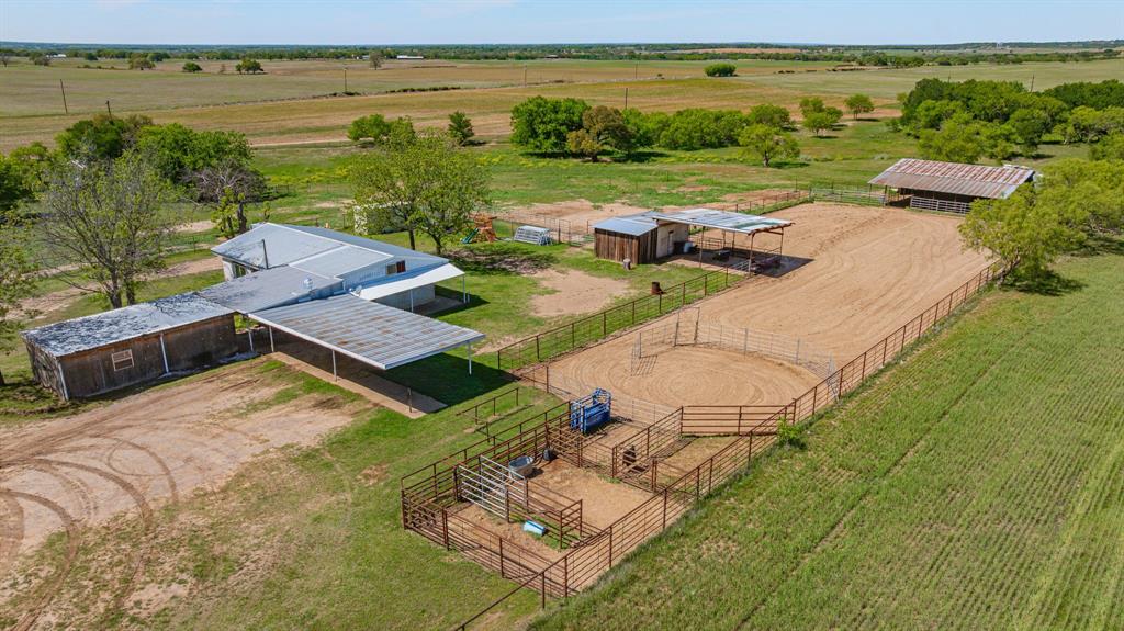 Newly featured is this amazing home situated on just under 10 acres, the primary home includes 3 bedrooms and 1 full bathroom. A breeze way separates another living area that consist of a laundry room, additional bedroom and bathroom. This property is so diversely suited for many options such as a great starter home for horse enthused families or a great income producing property for investors that seek multiple avenues of income on one property. With attached coverage there is ample room for getting vehicles and equipment out of the inclement weather Texas has to offer. The perimeter of the property is fenced as well as cross fenced for multiple paddocks, a meticulously maintained arena includes sorting and holding pens as well as a cattle Shute and roping box. Other improvements include a covered wash bay, well house, storage area, and tack room. Situated behind the arena is a 50x60 covered barn that could easily be made into separate horse stalls, feed storage, additional tack room or whatever best suites your needs. The scattered woods within the property provide an abundant habitat for wildlife such as dove, wild pigs, deer and varmints making the hunting on this little oasis exceptional. Let's setup you're showing today on this one because it will not last long at all.