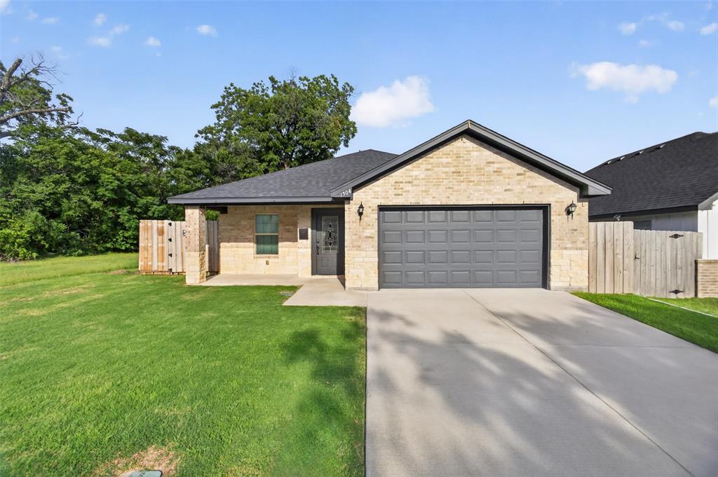 Built in 2019, this thoughtfully designed Fort Worth home offers the perfect blend of modern finishes, functional living, and exceptional convenience. The open-concept floor plan creates a natural flow between the living, dining, and kitchen spaces, making everyday living and entertaining effortless. At the heart of the home, the kitchen showcases granite countertops, stainless steel appliances, rich wood cabinetry, a gorgeous tile backsplash, and a versatile movable island that can be arranged to fit your needs. The private primary suite serves as a comfortable retreat, featuring a spacious walk-in closet complete with built-in shelving and beautifully appointed bathroom with granite countertops and an oversized walk-in shower. Two additional bedrooms, a secondary full bath, and a dedicated laundry room provide comfort and flexibility for family, guests, or a home office. Outside, the fully fenced backyard offers space to relax, entertain, or simply enjoy the outdoors. Conveniently located just minutes from Downtown Fort Worth with quick access to I-35W, shopping, dining, and major employers, this home offers the perfect blend of accessibility and everyday comfort. Combining newer construction, quality finishes, and unmatched convenience, this Fort Worth gem presents exceptional opportunity to own a home that truly checks all the boxes—all at an exceptional value.