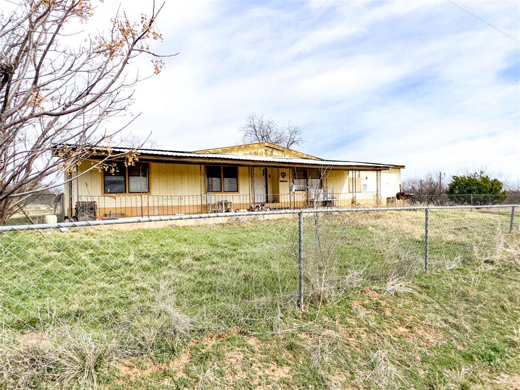 Opportunity awaits on this plus or minus 1.446 acre tract of land near Cisco College. The property includes a 1980, 4 bedroom, 2 bath doublewide in need of restoration, situated on Lots 7 & 8 along with a large attached garage on a concrete slab. Ideal for redevelopment, these 9 lots would make an excellent location for a new manufactured home or barndominium, offering a country setting with quick access to downtown Cisco. Sold AS-IS.