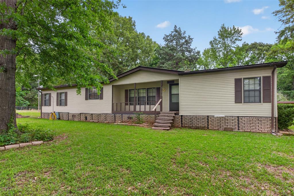 This home has a metal roof, concrete drive up patio with a ramp & the exterior walls are thicker than most manufactured homes. On a well and has city water. This home is not in a flood zone. Will come with a 1 year Guard Home Warranty with a favorable offer to the seller. The mineral rights do not transfer to the buyer.