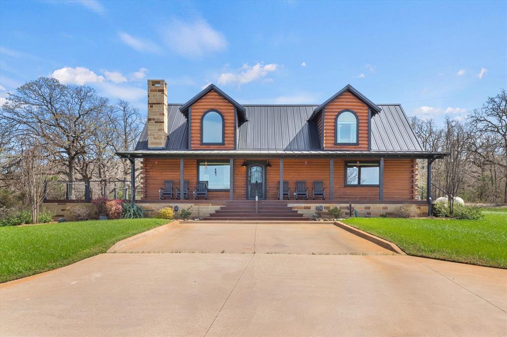Welcome to The Bluffs at Saint Jo — where scenic beauty, income potential, and Texas charm come together.
This Rare acreage with ag exemption for bees offering breathtaking bluff views, unforgettable sunset backdrops, and exceptional privacy just over an hour from Dallas and Fort Worth. The elevated setting provides a stunning location, ideal for weddings, events, or simply enjoying the natural beauty of the land. Abundant wildlife, including deer, adds to the peaceful, scenic atmosphere.

The property features two custom log cabins designed with rustic charm and modern comfort. Each cabin offers a warm, cozy feel with spacious open-concept living, vaulted ceilings, wood finishes, and inviting interiors perfect for relaxing or hosting guests. The first cabin includes approximately 1,988 sq ft with 3 bedrooms and 2 bathrooms, while the second offers 2,020 sq ft with a similar layout.

Currently hosting wedding and events, the property provides rental opportunities with room to add additional rentals. Ideal as an investment, private retreat, or full-time residence with the benefit of a current ag exemption.