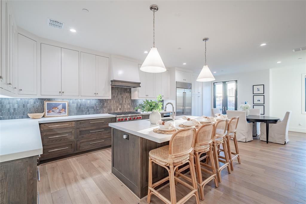 No expense was spared in these gorgeous townhomes by Stainback Construction. Located right next door to Snider Plaza shopping center, this luxury townhome boasts all the highest end features such as Wolf and Sub zero appliances, hardwoods all throughout, smart home technology, Pella doors and windows with automatic shades, California closets and much more. This unit features a highly functional three story floor plan with a private elevator, a chef's kitchen, a magnificent primary suite and bath, as well as a 3-car garage. Don't miss out on this incredible opportunity to buy a brand new luxury townhome in the heart of University Park!
