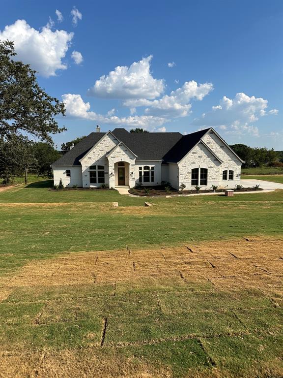 Terrina Custom Homes is offering this single story ranch on 2 acres with 4 bedrooms, 4 bathrooms & oversized 3 car garage, totaling 3,068 square feet. Located in lush Weatherford, Texas just about 4 miles outside city limits, this property boasts of country living with its own water well and allowable horses & livestock.

The kitchen is the heart of this home, and this one sets the pinnacle, ample enough to handle holiday gatherings with large families. The breakfast bar seats about 8, food prep island with smaller sink while the main sink overlooks the living room, plenty of cabinets and counter space, and the stonework and kitchen design are amazing. The flooring in the major living areas is hand scraped oak flooring stained on site at the house (if early enough the buyers get to select color stain), solid wood entry doors and extended patio covers give plenty of shade to accommodate outdoor gatherings with a fireplace to keep warm in the winter, the patio ceilings are tongue & groove hardwood...stunning!

The living room ceiling has crossed wooden beams, a fireplace, and sits off the kitchen and dining areas keeping everyone together and provides a great family setting. A Jack & Jill bath adjoins the 2nd & 3rd bedroom together and the 3rd bathroom sits just off the back door to the patio giving ideal access for those great outdoor gatherings. A perfect sized office study is right off the entry foyer keeping it nice & quiet from the main areas.
The primary bedroom closet space is extensive with built in shoe rack & fulfills the most difficult criteria in a home search! An oversized 3 car garage has a built-in staircase that leads up to a wonderful storage area above the garage helping keep the clutter out of the way.
Terrina Homes is a premier boutique builder in North Texas & it's high-end finishes are easily appreciated by touring our model home at 1000 Old Oaks Ct.