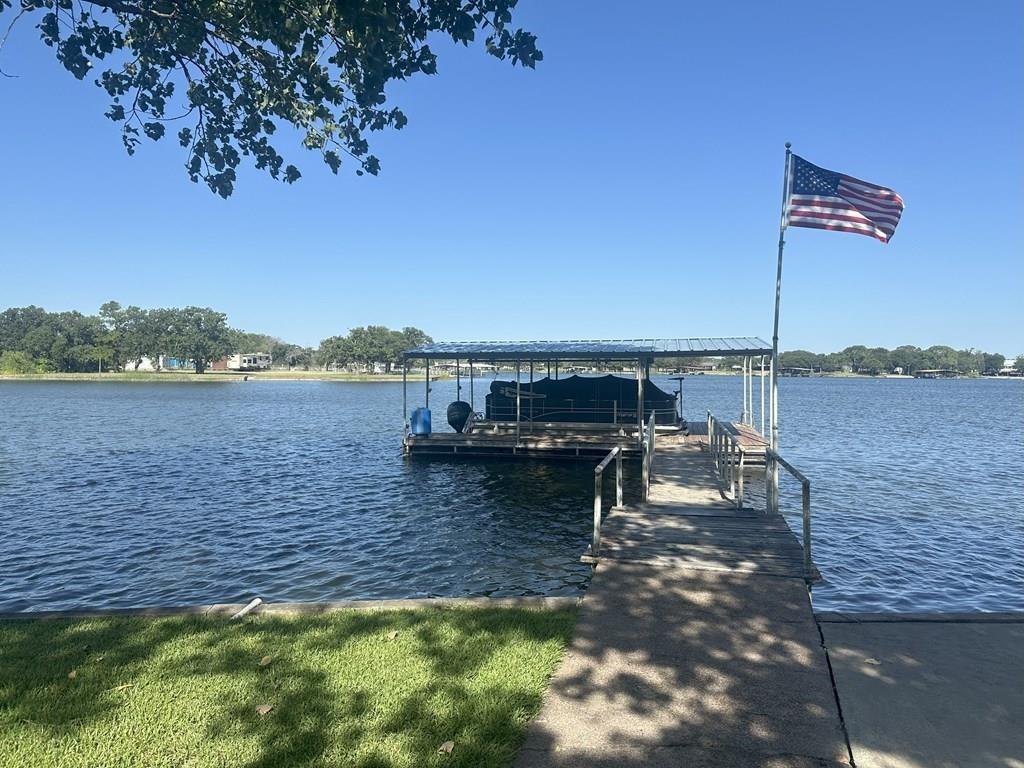 Lakefront living at its finest! Welcome to 406 County Road 530 on beautiful Lake Leon your fully furnished, turn-key getaway. This stunning 3-bedroom, 3-bath home comes complete with all appliances, furniture, and even a boat just bring your bags and start enjoying lake life immediately. Nestled on a quiet road with serene waterfront views, this well-maintained property is designed for comfort, relaxation, and fun. Inside, you'll find an open-concept living and kitchen area perfect for entertaining, with plenty of windows showcasing the lake. Each bedroom offers generous space, and the three full bathrooms provide convenience for guests and family alike. Step outside to your private slice of paradise featuring a dock and private boat ramp perfect for fishing, boating, or simply enjoying peaceful sunsets over the water. Whether you're looking for a weekend retreat, a short-term rental investment, or your full-time dream home, this property has it all. Don’t miss your chance to own a piece of Lake Leon schedule your private showing today!