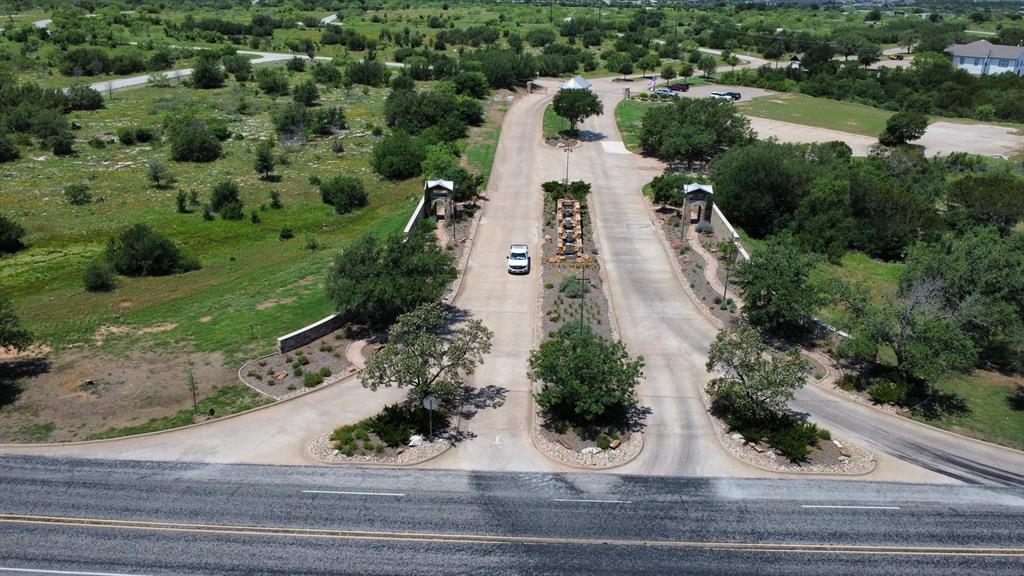 What an amazing, inexpensive opportunity to have your very own piece of The Cliffs Resort on beautiful Possum Kingdom Lake! No timeline to build, bring the builder of your choice! Property owners enjoy 36 rounds of golf per year, two swimming pools, full service marina, spa, grill and bar, tennis or pickle ball and so much more! Water and sewer are already at the lot ready for you to make your dream home a reality. Almost one quarter acre on this cul de sac lot offers plenty of room for your getaway lake retreat, or forever lake community home.