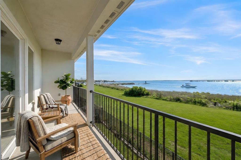 RATE BUYDOWN ON THIS HOME! Easy boat access, walk down your backyard steps, through your back gate, straight to Captain's Cove Marina to your docked boat No I30 bridge traffic! Gated community, custom home has luxury finishes, ideally located before I-30 bridge, just under 30 min from Dallas. Beautifully appointed with the bonus of waterfront living, enjoy easy marina access just a short stroll out your back gate, without the upkeep or expense of a dock. Features 4 BR, 3.5 BA, office, gameroom, low-maintenance exterior. Inside,a neutral design palette, soaring 12-ft ceilings,open-concept layout,built-in surround sound.Walls of windows fill the home with natural light,perfectly showcasing the lake views.Most windows have cellular shades with energy-efficient shielding,helping regulate temp,enhance comfort.Downstairs is an open-concept layout connecting the living, kitchen, and dining areas.Kitchen is a chef and entertainers dream!It's large island with breakfast bar anchors the space perfectly.The spacious office easily doubles as a flex space.Upstairs, the oversized private primary suite is a true retreat with its own balcony to enjoy panoramic lake views and a spa-inspired ensuite bath featuring an oversized shower, separate vanities and freestanding tub, also with views of the lake.The 3 secondary BR are spacious and all have walk-in closets.A spacious game room delivers the perfect setting for movie nights,game days or a relaxed secondary living space.Enjoy morning coffee,sunset views and the refreshing lake ambiance from your covered back patio, a low-maintenance yard.This is the only street this side of the bridge giving direct access to the large lakefront greenbelt, marina and park!Sentricon termite bait system provides an added layer of protection and peace of mind.Situated on premium open water.No stumps,great for boating,kayaking and lakeside living right from your backyard.Well maintained, ideally located near I-30 and 190.Quick commute to work corridors.