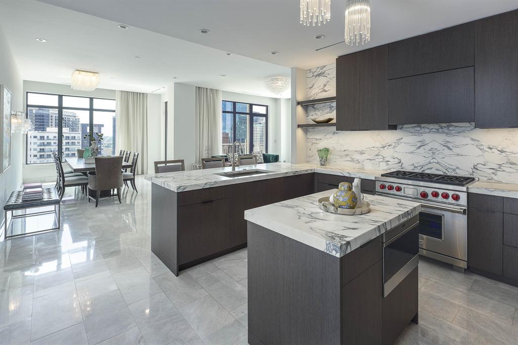 Prepare to be captivated by this unparalleled condo at the prestigious Ritz Carlton Residences, where luxury knows no bounds. Experience a masterpiece of design with a complete modern redesign by Milan Custom Build that sets it apart from any other. The open kitchen exudes elegance & functionality with its top of the line appliances including a Miele coffee maker & dry bar with wine chiller. Marvel at the Venetian plaster walls that seamlessly blend with the marble & wood floors that grace every corner, creating an atmosphere of refined sophistication. Indulge in the primary suite with a blissful bath, where a freestanding soaking tub invites you to unwind in style. Situated in the prime Uptown location, convenience meets luxury, offering a lifestyle unmatched by others. Enjoy access to five-star hotel amenities that elevate your living experience to new heights. This is more than just a condo; it's a sanctuary of opulence & refinement, awaiting your presence. Offered fully furnished.