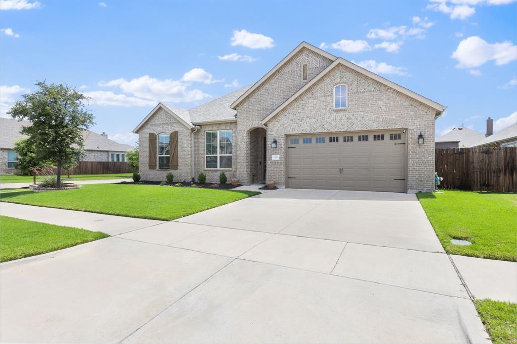 Exceptional value in Waxahachie! This upgraded home features 3 en-suite bedrooms, each with a private full bath and oversized walk-in closet, plus a dedicated office that can easily serve as a 4th bedroom! Soaring 12-foot ceilings, an open-concept design, and premium finishes throughout create a spacious and inviting atmosphere.

Enjoy entertaining indoors and out with a media room complete with an included sound system and a tiled covered patio perfect for relaxing evenings. The refrigerator conveys with the home, making this property truly move-in ready.

The third-car garage has been customized with built-in cabinetry and a sink, creating the ideal workshop, hobby space, or additional storage area. Best of all, the PID has been paid in full, providing significant savings compared to many neighboring properties.

With high-end upgrades already completed and exceptional features throughout, this home offers luxury, convenience, and value that is hard to match at this price point. Schedule your private tour today!