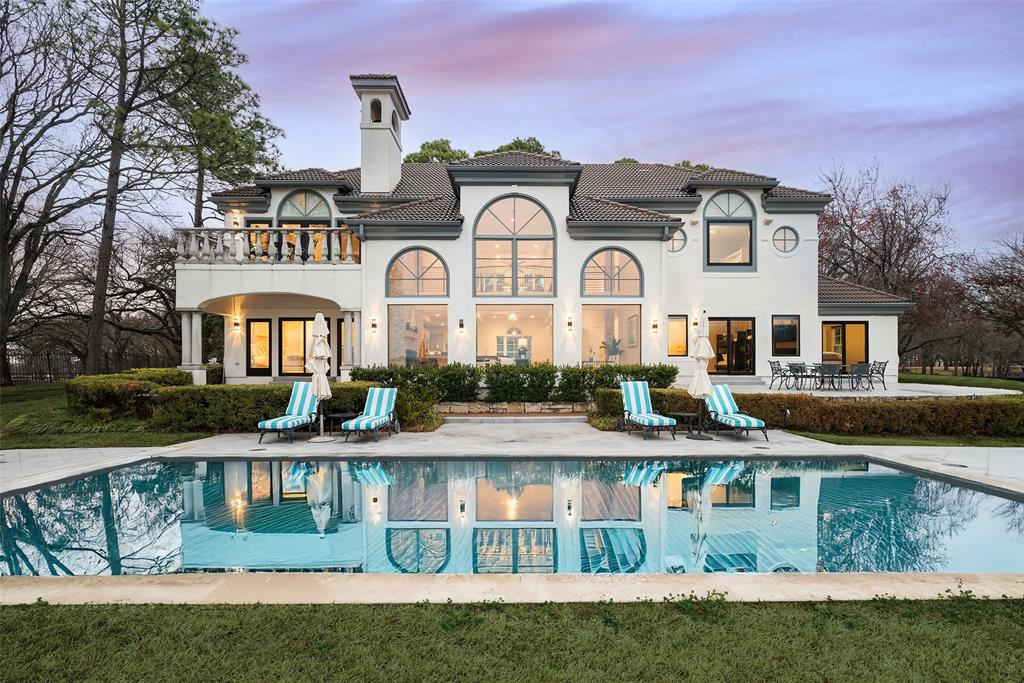 Say hello to your newly remodeled escape from the city on DEEP WATER lake frontage of 337 feet. Enjoy as your primary or secondary+ residence. This spacious, light-filled home, sitting atop 1.16 acres on Cedar Creek Lake, within an exclusive community of only 5, multi-million dollar properties, shimmers with stunning lake views from every room, including all 5 en-suite bedrooms. New floor-to-ceiling windows span the lake-facing landscaped backyard, patio and pool, providing unobstructed lake views, inviting the outdoors in. The open-concept floorplan with its chic, modern kitchen, stainless steel appliances, and custom island, adjoins the 25-ft ceilinged Great Room and its floor-to-ceiling fireplace. Easy-to-maintain, yet with an eye to modern design, the Great Room and kitchen floors are ceramic tile. Engineered wide plank flooring runs throughout the remainder of the house. Wide, eye-catching, modern, custom-built staircase links the home’s 2 stories. Second floor primary bedroom has a stone fireplace and glass doors leading to a private balcony. The primary bathroom includes a custom double vanity, a large walk-in shower, large walk-in closet and separate tub. Boathouse (1200 sq ft) includes two boat slips, and double jet-ski lifts, topped by an over-sized sun-deck. Underground 1000 gal. gasoline storage tank and fuel line to the dock. Just one more amenity of many that this amazing property offers.