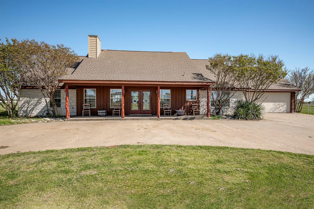 Welcome to the serene tranquility of this 24.87-acre equestrian property nestled conveniently in the heart of the of Cross Roads and Aubrey ranch area, yet mere minutes to the conveniences of Frisco, Denton and Prosper. The residence includes freshly stained cedar exterior-stone combo, new roof and AC in 2023. Revel in the beautiful view of the sunrise from the covered back porch or expansive balcony.  Enjoy the rustic wood floors, beautifully updated kitchen opposite the inspired Great Room with a soaring ceiling and 2 story floor to ceiling Austin stone fireplace surround. The upstairs bonus room provides space for a great game room, media room or craft room. The property includes a 118ftx120ft enclosed equestrian center, nine-stall horse barn with tack room, electric, water, three loafing sheds, multiple outdoor riding areas including an exterior round exercise pen and a separate lead walker, multiple pipe fence turnouts with another huge pasture for additional horses or cattle.