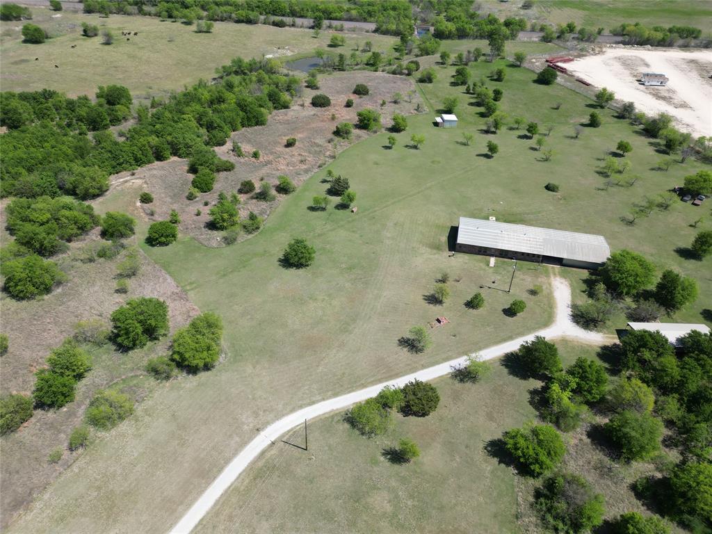 Welcome to your private Texas retreat on 26+ acres at 2101 Ridge View Drive in Cleburne. Tucked behind a gated entrance, this property offers the perfect blend of space, functionality, and peaceful country living—just a short drive from town.
As you enter, you’re greeted by wide-open land, mature trees, and endless possibilities. Whether you're looking for a homestead, ranch setup, or a place to run a business from home, this property is built to accommodate.
The land is the true highlight—26+ acres of usable space ideal for livestock, recreation, or future expansion. With plenty of room to roam, you’ll enjoy privacy, scenic views, and that hard-to-find freedom that’s becoming increasingly rare in North Texas.
For those needing workspace or storage, the property features two large shops along with additional outbuildings, providing flexibility for equipment, hobbies, or business operations. Whether you're a contractor, car enthusiast, or simply need extra room, this setup delivers.
The gated entry adds an extra layer of security and exclusivity, making this property feel like your own secluded estate.
Opportunities like this don’t come often—acreage, functionality, and privacy all in one. Come experience the potential and lifestyle this property has to offer.