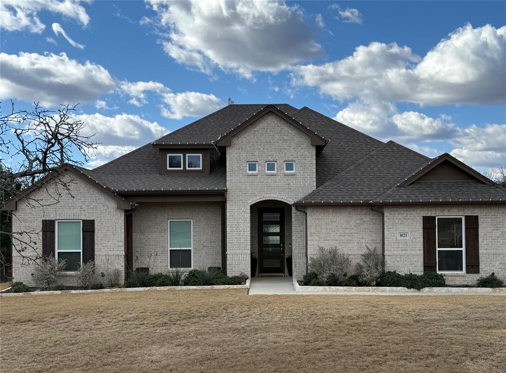 Beautifully situated on a spacious one-acre lot, this impressive 4-bedroom, 2-bath home offers comfort, style, and room to enjoy. The inviting open-concept layout features a large family area with cathedral ceilings, creating a bright and airy atmosphere perfect for gathering and everyday living. Large Kitchen with breakfast bar. While the generous walk-in pantry ensures excellent storage. The split-bedroom design provides privacy and convenience. Master Bath has separate vanities and oversized walk in closet. Step outdoors to your private PARADISE to a fenced gunite waterfall swimming pool accented with a tanning pad and a covered back porch with a cozy fireplace—ideal for relaxing or entertaining year-round. Completing the property is an incredible 1,800 sq. ft. workshop walls are insulated concrete forms 12” thick, water along with 40 amp circuit running from the home provides endless possibilities. Two car Garage Separate Side Entrance.  This home truly has it all!