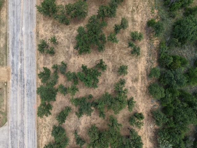 Discover the perfect place to build your dream home on this gorgeous lot filled with mature trees and natural beauty. Enjoy the peaceful setting, abundant shade, and privacy that only established trees can provide. This property offers a picturesque backdrop and plenty of space to bring your vision to life. Conveniently located with easy access to local amenities. Don't miss this opportunity to own a beautiful lot ready for your dream home.
