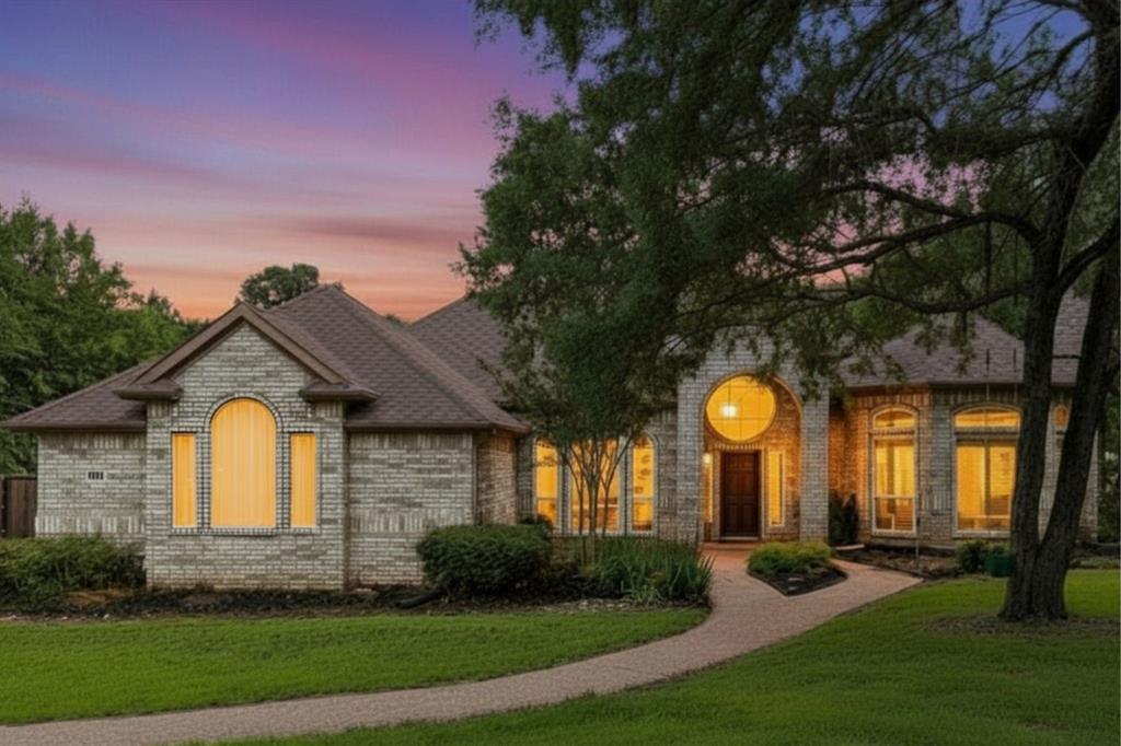Located in The Peninsula at Twin Coves community of Flower Mound Texas in Denton County & zoned to Lewisville ISD, this 4 bedroom, 3 full bathroom home offers approximately 3,546 square feet of single story living on a 1.15 acre cul-de-sac lot near FM 2499, FM 1171 & Highway 121. The location provides convenient access toward DFW Airport, Grapevine Lake, Highland Village & downtown Flower Mound, while remaining close to shopping, dining, parks & hiking trails. Buyers exploring homes in The Peninsula at Twin Coves in Flower Mound Texas may appreciate the balance of privacy, mature trees & established neighborhood living with nearby access to Twin Coves Park & Grapevine Lake. If you are searching for 4 bedroom homes in Flower Mound Texas within Lewisville ISD, the layout offers spacious living areas with functional separation for entertaining, work from home needs & everyday living. The main living area features hardwood flooring, large windows with natural light, surround sound & gas fireplace, creating a comfortable gathering space. The kitchen includes updated cabinetry, pull out pantry shelving, gas cooking, double ovens & upgraded lighting. The primary suite offers a private retreat with a sitting area, custom closet system, dual vanities, spa tub, bidet, & zero entry shower. A standout feature includes paid off solar panels, smart home controls, updated windows & insulation in 2025, and EV charging capability. Outdoor living creates a resort style setting with a saltwater pool & spa replastered in 2024, outdoor kitchen, gas grill & landscaped backyard with new iron fencing. Additional features include a 3 car attached garage with epoxy flooring & overhead storage. The home is served by Liberty Elementary, McKamy Middle School & Flower Mound High School within Lewisville ISD, and is located near Coram Deo Academy. This property offers a strong combination of acreage, smart home functionality & positioning within the Flower Mound Texas market near Grapevine Lake.