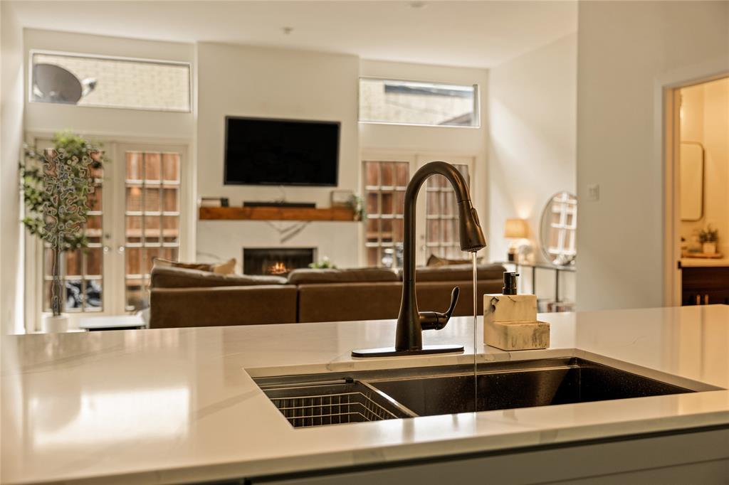 LOCATION. TURNKEY. EFFORTLESS. Beautifully renovated condo in the heart of Oak Lawn, 4015 Holland Avenue combines timeless character with clean, intentional updates and one of the best locations in Dallas. Natural light pours through oversized wood framed double French doors, while tall ceilings and a wood burning fireplace create a space that feels warm, open, and inviting. The kitchen was completely redesigned with custom cabinetry, quartz countertops, and new appliances, complemented by new paint, flooring, and extensive system upgrades including HVAC, electrical, and water heater. The private porch offers the perfect spot to entertain or unwind, while the oversized bedrooms provide a layout that lives comfortably and functionally. Just minutes from Dallas Love Field, Katy Trail, Highland Park Village, and some of Dallas’ best restaurants, coffee shops, and nightlife, this is city living at its best in a location that truly doesn’t get better than this.