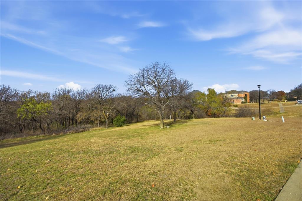 Beautiful 1-acre homesite located at the end of a quiet cul-de-sac in the prestigious custom-home community of Lake Ridge.  Surrounding by rolling hills reminiscent of the Texas Hill Country, this exceptional lot is ideal for stunning multi-level custom home.  Mature trees line the back of the property, creating picturesque backyard setting. Plus, enjoy access to the 3.6 mile Lake Ridge trails.  Conveniently located just minutes from Joe Pool lake, Tangle Ridge Golf Club, sports parks, and Cedar Hill's Uptown district with dining and shopping. Easy access to Mansfield, Grand Prairie and within 30-45 minutes of Downtown Dallas, Fort Worth, DFW Airport and Ball Park of Arlington.  Come and see to appreciate.