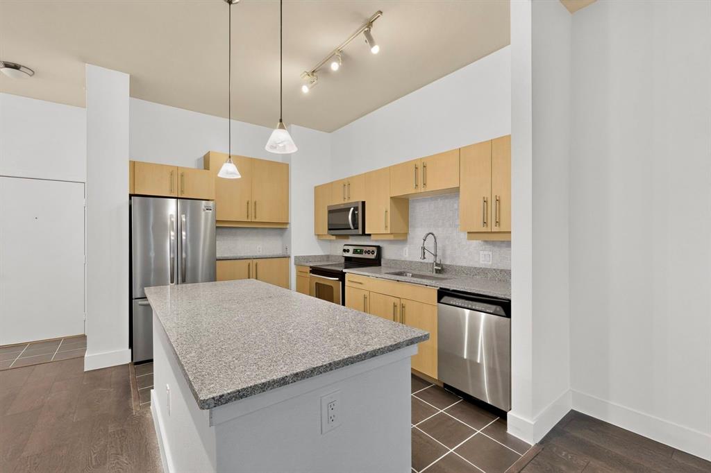Courtyard-facing corner unit featuring all new interior paint, automatic blinds & a highly private layout in an amazing Uptown Dallas location! As a top-floor end unit, this condo has no neighboring unit immediately beside or in front & does not align directly with the unit across the hall, providing an extra level of privacy AND quiet. A bright, welcoming floor plan opens to the kitchen & separate dining area, complete with a large kitchen island, NEW stone countertops (2026), pendant lighting & SS appliances. High ceilings & oversized windows allow for tons of great natural light throughout, plus a sliding door opening to a Juliet balcony in the living room, complete with automatic shades. The bathroom is extremely spacious & has multiple entries for easy access from the primary bedroom & main spaces, featuring dual sinks & a huge walk-in closet. Second bedroom could be used as an office, studio, workout space or guest room. Utility closet with full-size washer & dryer area can be closed off when not in use. Amenities in this gated community include covered parking, a saltwater pool, gym & dog run—the full package! Right down the street from Craddock Park, 5 minutes to Love Field airport & steps from the heart of Oak Lawn, Downtown Dallas, Arts District, Hospital District & West Village—you won't want to miss this fabulous condo in an unbeatable location.