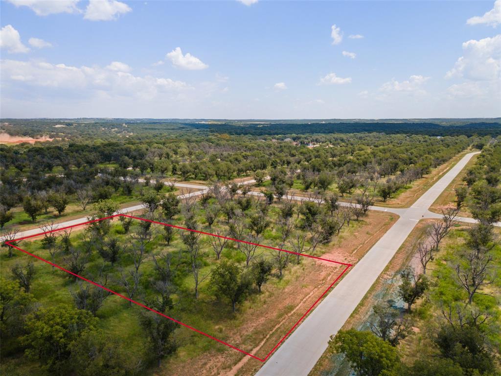 Build your dream home in the highly sought after airpark community of Pecan Plantation.  This beautiful 1.5 acre lot offers direct taxiway access, making it the perfect choice for aviation enthusiasts.  This property provides plenty of space to design your custom home while enjoying the convenience of flying right out your own neighborhood.  Pecan Plantation is more than just a place to live it's a lifestyle.  Residents enjoy amenities such as two golf courses, a clubhouse with dining, tennis, swimming pools, walking trails, and activity center, horse facilities, plus so much more.