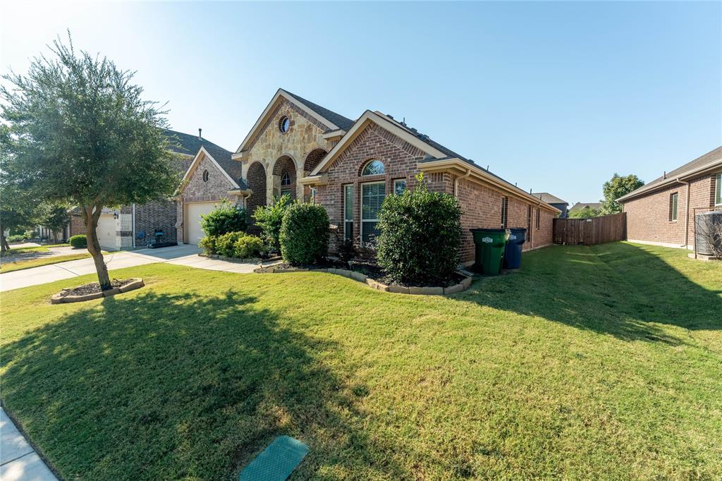 This home layout featuring split bedrooms, a formal dining area, and a versatile game room perfect for entertaining. The open-concept kitchen overlooks the family room, creating the ideal gathering space. The primary suite offers a relaxing garden tub, separate shower, and large walk-in closet. Enjoy outdoor living on the extended covered patio and plenty of parking with a two-car garage. Located in the Woodcreek community that provides a pool and highly rated Rockwall schools!