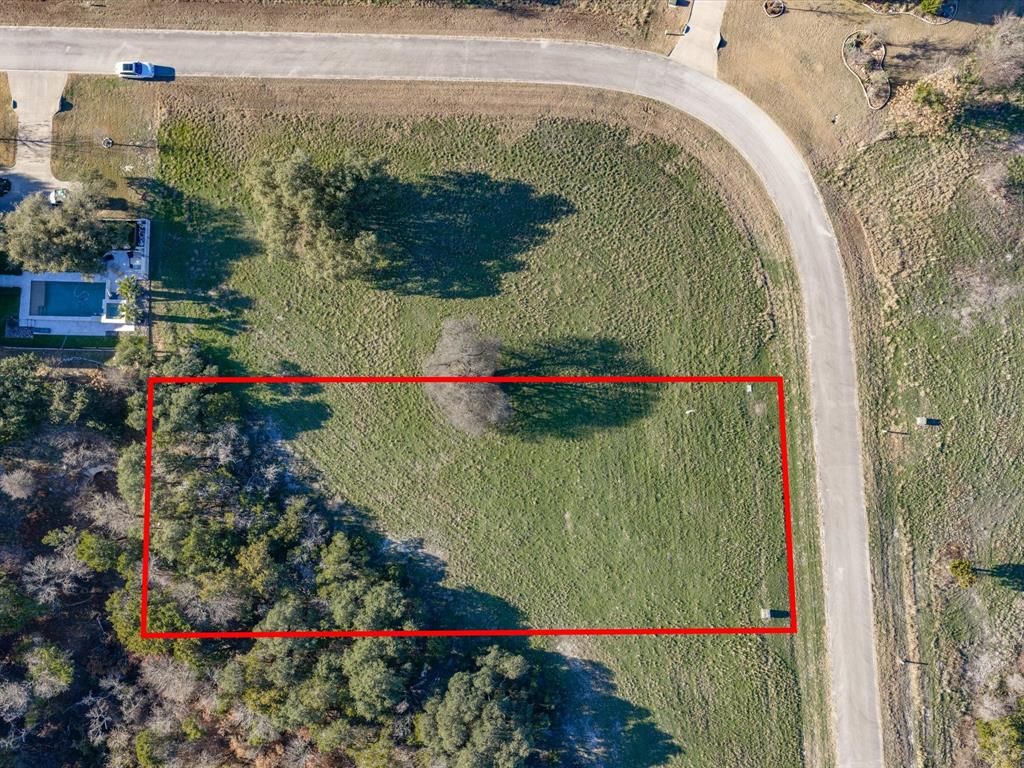Set within the master-planned community of The Retreat, this 0.5621 acre homesite on Crichton Court offers a quiet cul-de-sac setting with mature trees and access to water, sewer, and electric. The location provides a balance of privacy and convenience, positioned outside Cleburne city limits while still offering community amenities designed for everyday enjoyment. At mid-block, the address places the lot near the heart of The Retreat’s recreational network and allows flexibility for future design under community builder restrictions, with full details available in transaction documents.

Property owners have access to a state-of-the-art 18 hole golf course, clubhouse with restaurant and pool, a fully equipped fitness center, and two parks with walking trails. Additional outdoor features include a playground, a second pool, picnic areas, and sports courts, creating year-round opportunities for relaxation and recreation. The gated entrance is staffed 24 hours for controlled community access. This property is served by Rio Vista ISD and offers an exceptional opportunity to build within one of the region’s most scenic and established resort communities.