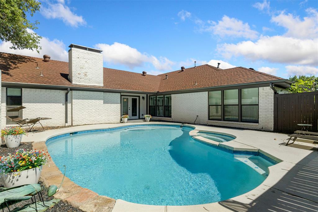 Completely remodeled Prestonwood home with thoughtful layout and a strong connection to outdoor living, this updated residence offers three distinct outdoor spaces, flexible entertaining areas, and refined finishes throughout. Morning light moves through the open living spaces while wide-plank flooring and designer tile create a clean, cohesive look with no carpet anywhere in the home. The chef’s kitchen was designed for both function and gathering, centered around a 14-foot quartz island with seating and workspace to spare. Commercial-grade 6-burner range, pot filler, dual sinks, beverage refrigeration, double ovens, and custom cabinetry with soft-close drawers create a space that feels both polished and practical, with plumbing already in place for a second dishwasher, currently occupied by an ice maker. The primary suite is positioned privately on one side of the home, while three secondary bedrooms are tucked away on the opposite wing beyond the family room, creating separation without losing flow. The primary bath features a separate shower and soaking tub, dual vanities, and a spacious walk-in closet with room for seasonal storage and daily organization. Outdoor spaces offer flexibility for entertaining, relaxing, and everyday use, including a grassy yard, a pool yard with additional green space, and a private side patio. A circular drive with porte-cochère entry leads to a welcoming arrival experience. Additional updates include remodeled bathrooms with frameless glass showers, updated plumbing, designer lighting, recessed lighting, engineered hardwood flooring, custom windows and front door, upgraded insulation, refreshed landscaping, pool equipment and plaster, fencing, and security cameras. Roof replaced approximately three years ago. Foundation work completed with transferable warranty. Stressless commute to Plano, Frisco, Uptown, Downtown. Easy access to the first HEB in Dallas and 2-miles from new Mavs arena.