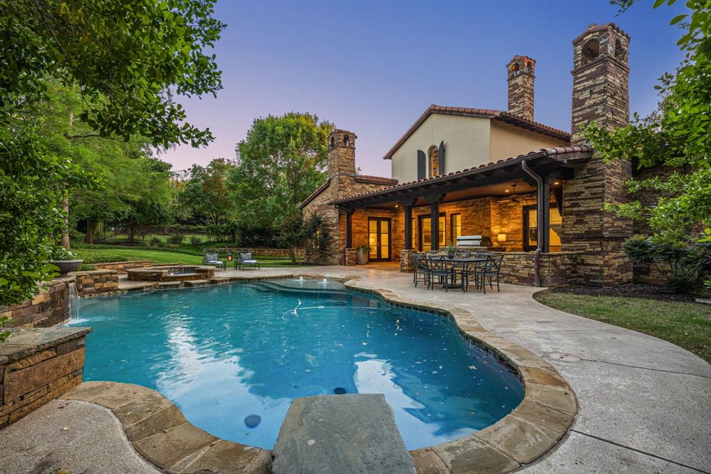 Beautifully appointed custom home on coveted King Fisher in the prestigious Vaquero Club, ideally positioned across from a serene fountain and pond. This stunning residence welcomes you with a circular driveway and a charming entry courtyard featuring a fire pit and lush landscaping—perfect for both relaxing and entertaining. In addition to the main courtyard, a second private courtyard sits just off the casita, complete with a fireplace, string lights, and a tranquil fountain creating an inviting, intimate outdoor retreat. The versatile casita offers the ideal space for a private guest suite or home office. Inside, the updated kitchen shines with quartz countertops, a center island and a cozy breakfast nook with its own fireplace. The expansive primary suite is a true retreat, featuring separate his-and-hers full bathrooms and closets. Recent updates include fresh paint and lightened flooring throughout, enhancing the home’s bright and airy feel. Step outside to a beautifully private backyard oasis with a pool and spa, ample green space and a covered patio designed for year-round enjoyment. Located in the highly sought-after Westlake community, residents benefit from automatic admission to Westlake Academy, an internationally recognized IB World School.