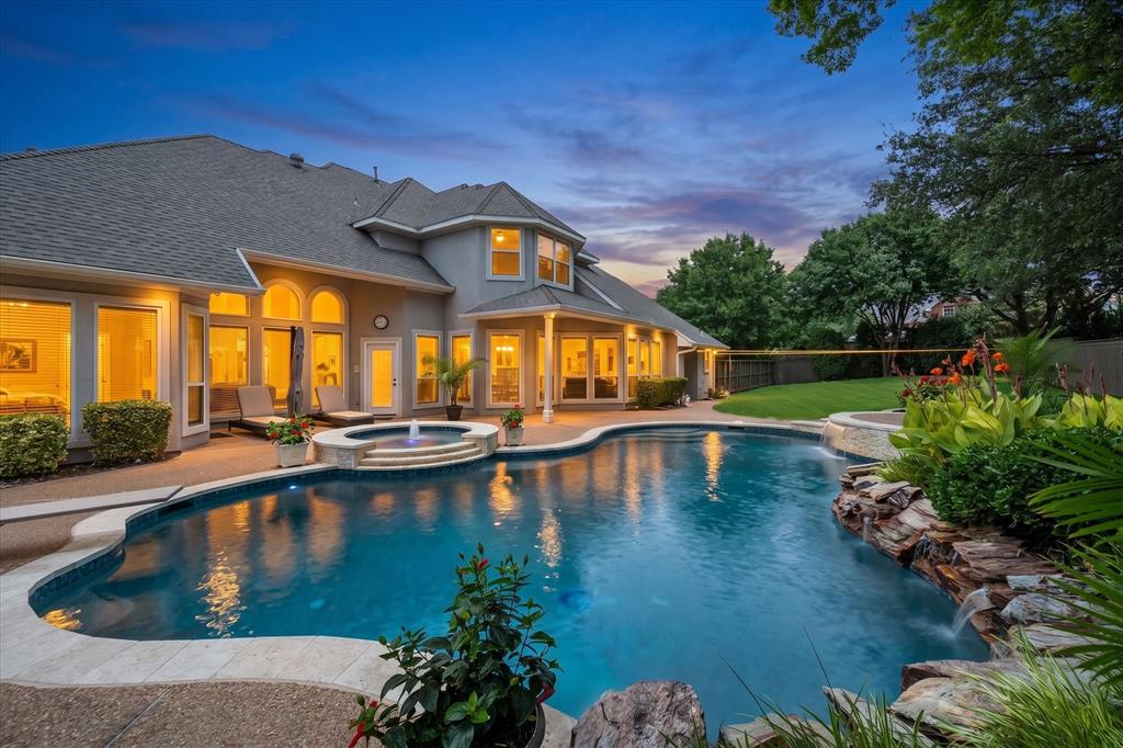 Nestled in the highly sought-after Timarron community and zoned to acclaimed Carroll ISD, this expansive home offers the perfect blend of luxury, comfort, and outdoor living. Situated on an oversized lot, the property provides exceptional privacy and abundant space to enjoy both recreation and gardening.

The backyard is a true retreat, featuring a resort-style pool and spa designed for year-round enjoyment and effortless entertaining. Beyond the pool area, you'll find generous green space with endless possibilities for gardening, play, or creating your own outdoor oasis.

Inside, the home offers spacious living areas and a versatile floor plan that accommodates both everyday living and special gatherings. Large windows fill the home with natural light, creating a warm and inviting atmosphere throughout. Multiple living and dining spaces provide flexibility for entertaining guests, working from home, or simply enjoying time with family.

Whether you're relaxing poolside, cultivating your garden, or hosting friends and family, this remarkable property delivers a lifestyle that's hard to match in one of Southlake's most desirable neighborhoods. Residents enjoy access to Timarron's exceptional amenities and scenic surroundings, while being just minutes from Southlake Town Square's premier shopping, dining, and entertainment destinations. Convenient access to DFW International Airport makes travel effortless, adding to the home's exceptional appeal. Mature landscaping enhances the property's beauty and curb appeal, while the oversized lot offers a rare combination of privacy, outdoor enjoyment, and room to grow. This is a rare opportunity to enjoy luxury living, outstanding schools, and an unbeatable location in the heart of Southlake.