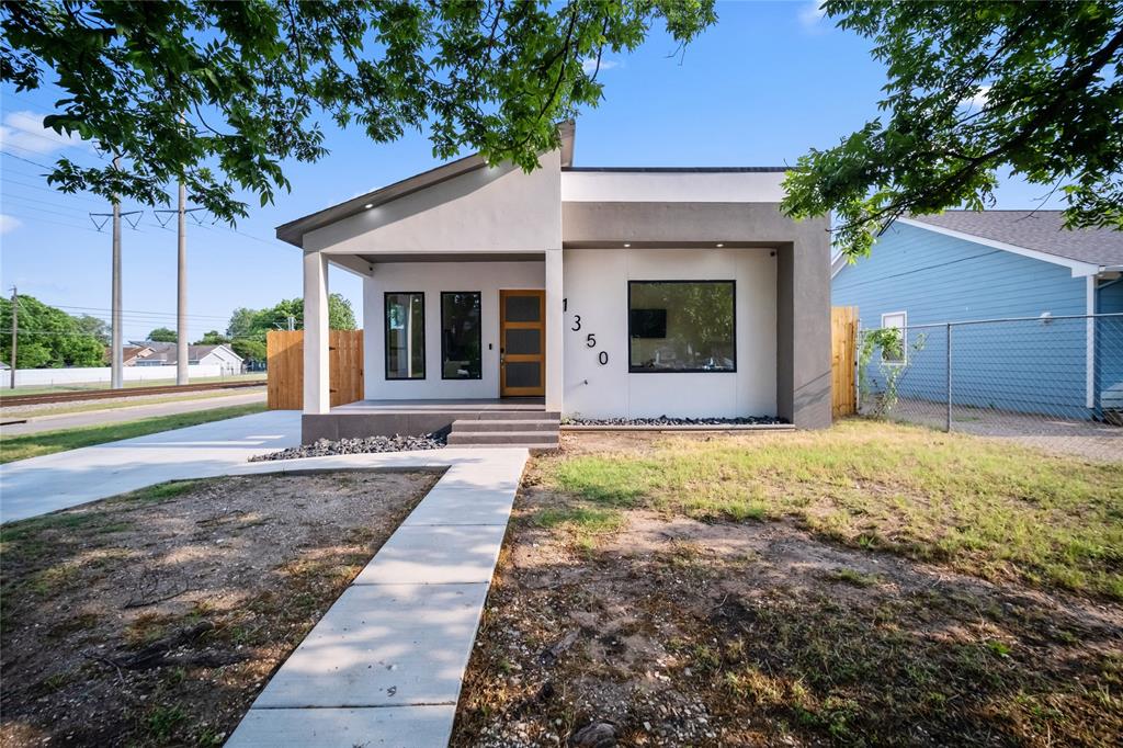Beautifully remodeled and filled with natural light, this modern retreat offers style, comfort, and an unbeatable location just minutes from Downtown Dallas, Bishop Arts, parks, and dining. The open-concept living and dining areas flow seamlessly into a stunning kitchen featuring custom wood cabinetry, white quartz countertops, stainless steel appliances, and a spacious island perfect for gathering. Hardwood floors add warmth throughout the main spaces and primary suite. Three bedrooms and two updated baths include a spa-like secondary bath with a freestanding soaking tub. Enjoy a welcoming front porch and large backyard ideal for entertaining or relaxing. Move-in ready and won’t last.