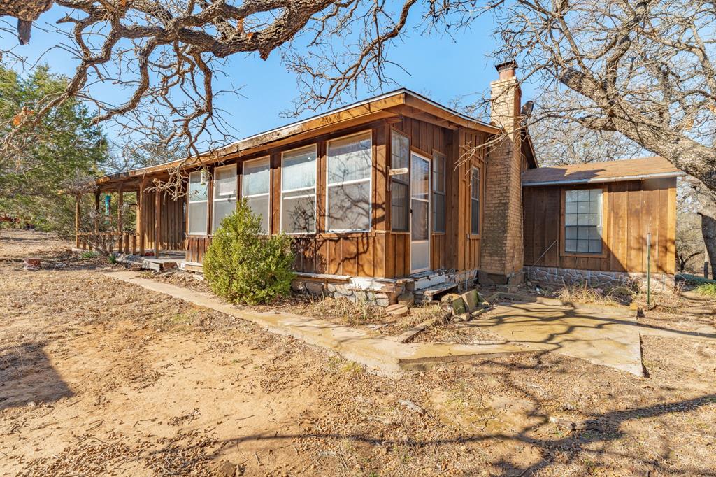 Take a look at this perfect opportunity to escape all the noise and indulge in quiet tranquil living. This beautiful 3 bed 1 bath home sitting on 6+- acres is ideal for escaping all the noise city living consist of now days. Speckled with beautiful oak trees and a small tank this property has many characteristics that make it such a beautiful place to call home. With a little help this home could easily be updated and renovated to your taste making a fantastic spot to live long term, or investment to sale for a profit. This home has water provided by a water well and is on its own septic system on the northwest corner of the home. There is an active hook up for an RV in the front of the property along with a carport for vehicle coverage on the. Also, there are several small buildings scattered throughout that could be fixed up or torn down for more space. Being at the end of this county road allows so much privacy to just set back and enjoy the awesome scene nature has to offer, along with beautiful views towards the back of the property of lake proctor. This property will not last long so make the time to come check it out today.