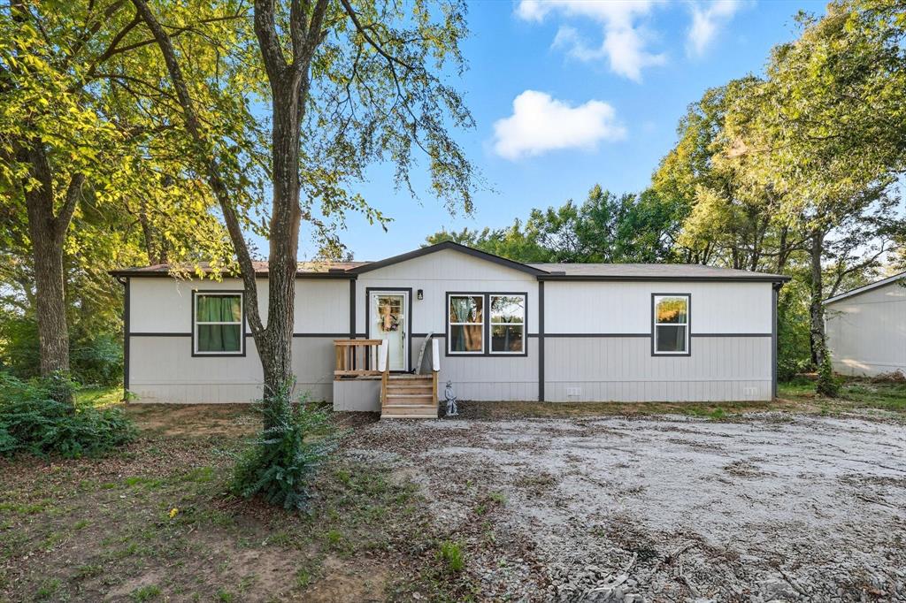 Welcome to this 2024-built manufactured home offering modern comfort and country charm. Featuring 3 spacious bedrooms and 2 full bathrooms, this home provides a functional split-bedroom layout with an open-concept living, dining, and kitchen area—perfect for both everyday living and entertaining. The kitchen is a true highlight with a large island for extra seating and prep space, plus a dedicated spot ideal for a coffee bar or beverage station. The home provides ample storage areas, as well as walk-in closets in every bedroom. The seller has added full gutters onto the home. Sitting on just under 2 acres of land, there’s plenty of space for outdoor activities, gardening, or simply enjoying the peace and privacy of your own property. The owners added full gutters around the whole home shortly after purchasing. The home is in great condition, move-in ready, and designed for easy living with contemporary finishes and country lifestyle. Whether you’re looking for your first home or to move to the country for more privacy, this property blends the convenience of modern living with the freedom of extra space.