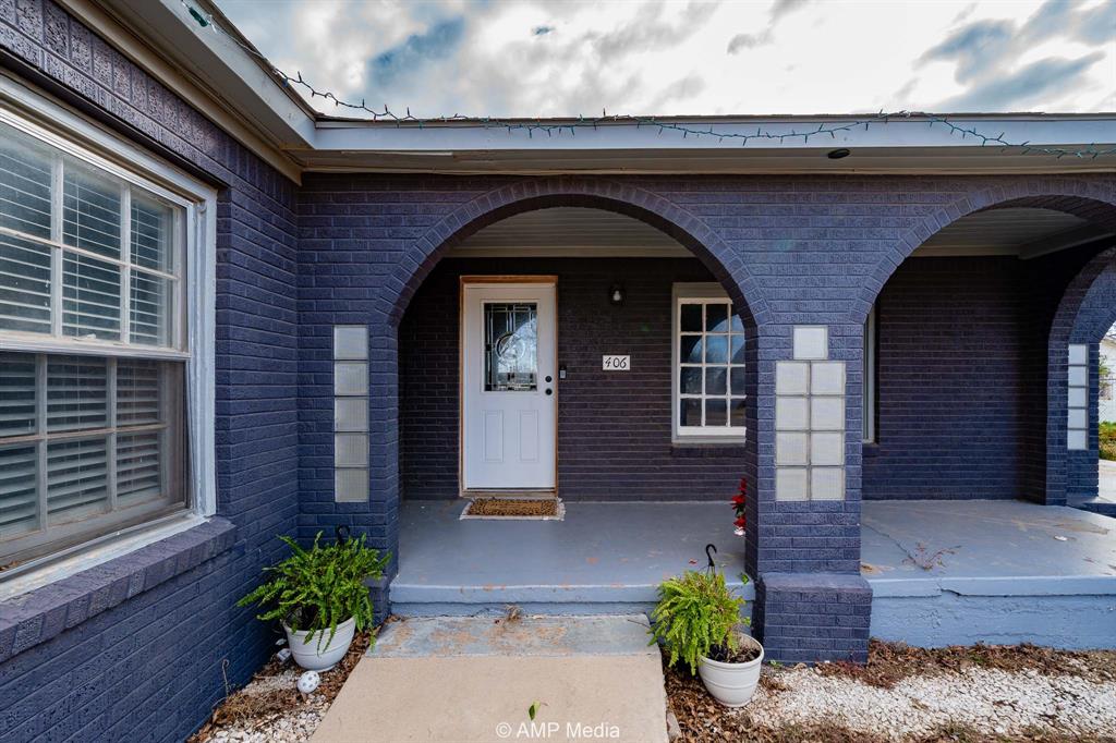 Seller is offering $3,000 towards the buyer's closing costs!
This charming three-bedroom 1940s brick home sits on a large lot and is filled with abundant natural light throughout. Recently painted, the home offers excellent curb appeal and a welcoming wraparound porch with covered front and back patios, perfect for relaxing or entertaining.

Inside, the living area features a cozy faux fireplace and flows seamlessly into a spacious dining area and a nicely updated kitchen complete with a beautiful tiled backsplash. The bathroom showcases a custom tile shower. Numerous renovations have already been completed, including updated plumbing and newer central heating and cooling, providing comfort and peace of mind.

The expansive backyard is ideal for family gatherings and outdoor enjoyment. Highlights include a large stamped concrete patio, a covered gazebo perfect for cookouts, and a 15x15 metal storage building with a concrete floor that provides excellent storage or workspace.

This well-maintained home is ideal for a family seeking space, character, and outdoor living. Don’t miss this opportunity, motivated seller! Call today to schedule your showing.