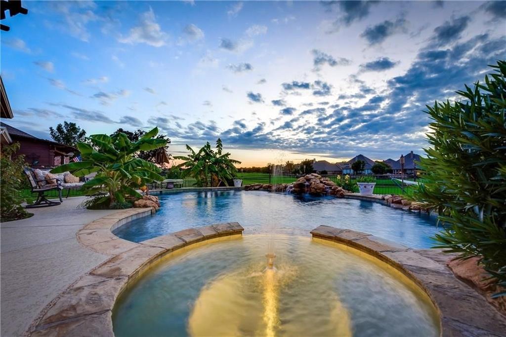 Nestled along the 3rd fairway, this exquisite residence is a vision of luxury living from dawn to dusk. Imagine waking up to the gentle panorama of the golf course and water views, and retiring in the evening with the same breathtaking scenery. Step inside, and you'll find a home that is as rich in detail as it is in comfort. Brazilian cherry hardwood floors grace the living spaces, sweeping arches and walls of windows that invite the outside beauty in.The thoughtful design encompasses an office, formal dining area, and a game room, providing versatile spaces. The interior is adorned with such as 2'' plantation shutters, crown molding, and a 100% brick exterior. The kitchen, boasts AVAVZA counters, a tasteful tile backsplash, and a ceramic cooktop. Step into the backyard, and discover a serene sanctuary where lush landscaping meets resort-style amenities. The heated saltwater pool and spa, framed by an oversized arbor that provides a shaded escape for year-round enjoyment. THIS IS IT!