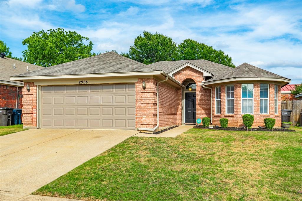 REDUCED PRICE! Updated One-Story Living in River Trails featuring NEW ROOF, NEW WATER HEATER, NEW GARAGE DOOR, and NEW STAINLESS RANGE & MICROWAVE for worry-free ownership from day one. New quartz counter tops being installed next month! Centrally located in the DFW Metroplex near DFW Airport, major entertainment venues, shopping, restaurants, and highly rated HEB schools. This move-in-ready home offers an open layout with wood-look tile flooring, vaulted ceilings, abundant natural light, and a spacious living room with brick wood-burning fireplace. The kitchen features white cabinetry, center island, generous storage, and open sightlines to living spaces. Oversized primary suite includes dual sinks, soaking tub, oversized shower, accent wall, and walk-in closet. Two additional bedrooms offer versatility for guests, office space, or hobbies. Large fenced backyard provides plenty of room for entertaining, pets, and play. Combining location, updates, comfort, and value, this home is one you do not want to miss.