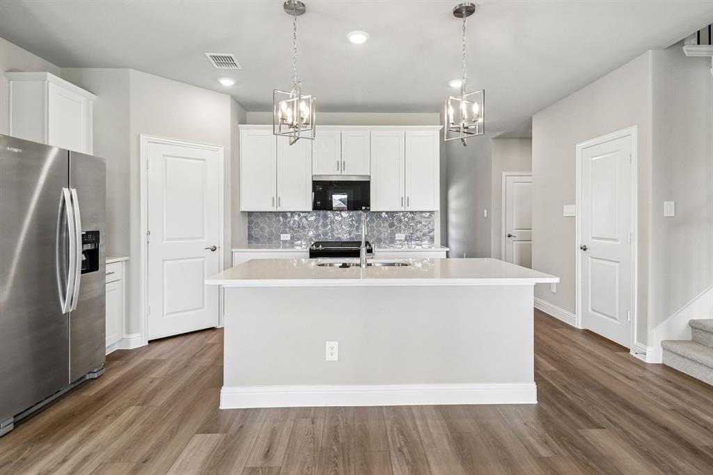 BRAND NEW energy - efficient home Sep 2026! Turn the kids loose in the Royal’s second-story media and game rooms while you entertain in the open concept great room. White cabinets with veined white quartz countertops, beige tone EVP flooring with beige tweed carpet. New energy-efficient move-in ready homes in Dallas-Fort Worth include a washer, dryer, fridge, and whole home blinds, plus they can be closing-ready in 60 days or less–guaranteed. Have it all: Relax in your private primary suite, enjoy the covered back patio, and our open concept floorplans, all with easy access to Fort Worth, Arlington, and Grapevine.