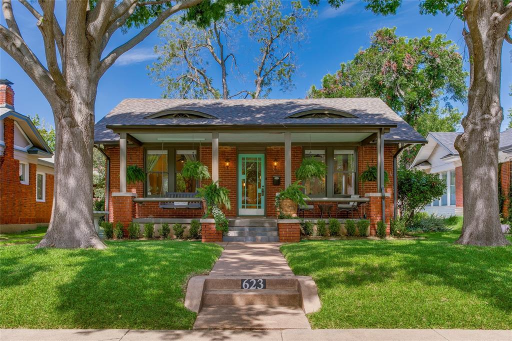 Located within the coveted Kings Highway Conservation District and mere moments from esteemed Rosemont Elementary, this beautifully maintained craftsman home stands proudly with the most inviting and spacious front porch—a welcoming retreat to enjoy quiet mornings or slow evenings. Inside the home you'll find warm hardwood floors and abundant natural light, creating a welcoming and cozy atmosphere throughout the designated formal spaces. The home's thoughtful renovations complement its historic character, offering today's conveniences without sacrificing its original appeal. The kitchen is designed for everyday living, featuring generous cabinetry, granite tile countertops, stainless steel appliances, and a cozy breakfast nook area perfect for those after school homework sessions while dinner is being made. Each of the two generous-sized bedrooms include rare walk-in closets, while the primary suite offers the added comfort of a private ensuite bath with original mint tile finishes. A beautifully renovated secondary bathroom down the hall showcases elegant marble finishes and ample storage space for added convenience. The versatile bonus room, connected to the secondary bedroom, overlooks the picturesque backyard and offers endless flexibility as a home office, nursery, or creative studio space. Outdoors, the private backyard serves as an ideal retreat, complete with mature landscaping, a newly installed privacy fence, and a sizable deck that beckons for al fresco dining and entertaining. An added bonus? The detached garage that includes an attached workshop, offering valuable space for projects, hobbies, or additional storage. From morning walks through the tree-line streets of N Oak Cliff to afternoons well spent at Twelve Hills Nature Center or dinner in bustling Bishop Arts District, this location makes it easy to enjoy everything this friendly neighborhood has to offer. Welcome home!