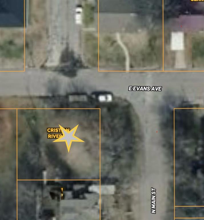 Prime corner lot in town, offering an excellent site for your next single-family residence new build. Mature crepe myrtles edge the property and set the stage for timeless curbappeal for your new home. Conveniently located near downtown and central to local schools, this property places you close to community amenities while maintaining small-town charm. Surrounded by new development, yet free from HOA restrictions, this lot is a rare opportunity to build in a growing area without added constraints.