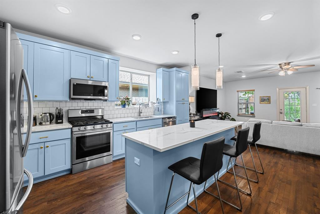 Beautifully renovated 3-bedroom, 2.5-bath home situated on a spacious oversized lot, offering modern style, thoughtful updates, and exceptional energy efficiency. Rich hardwood floors flow throughout the open living spaces, leading to a stunning kitchen featuring granite countertops, custom shaker cabinetry, stainless steel appliances, a gas range, subway tile backsplash, an oversized island, and abundant storage. The spacious primary suite provides a private retreat, while all bathrooms have been beautifully updated with designer finishes, including frameless glass showers, custom tile work, granite vanities, and contemporary fixtures. Additional highlights include a new roof (2022), newer windows, an interior utility area, and solar panels to help reduce energy costs. The large backyard offers endless possibilities for entertaining, gardening, or future expansion. Ideally located just minutes from Love Field Airport, Downtown Dallas, shopping, dining, and major highways, this move-in-ready home offers the perfect blend of modern comfort, style, and convenience. Schedule an Appointment through BrokerBay, for a guided tour contact listing agent to arrange a tour. Agent and buyer's agent to verify all information as it is deemed reliable but not guaranteed.