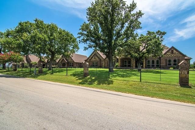 MULTI GENERATIONAL LIVING - LUXURY COMPOUND in Decatur, Tx located LESS than one hour to Dallas, Fort Worth, DFW Airport, Alliance Town Center, Southlake.  Experience an extraordinary opportunity to own a one-of-a-kind luxury compound designed for multigenerational living or those seeking space, privacy, and versatility. Nestled on 13 picturesque acres, this remarkable multi resident estate features a stunning main residence offering over 8,000 square feet of refined living space, complemented by two fully equipped guest houses—each with multiple bedrooms, bathrooms, and full kitchens—ideal for extended family, guests, or office space for staff for an at home business! 
A gated entrance welcomes you into the property, setting the tone for the privacy and elegance that define this estate. The outdoor living experience is truly exceptional, highlighted by a resort-style pool and spa, expansive entertaining areas, back porch lounge area features electric.
For hobbyists, entrepreneurs, or collectors, the property includes multiple spacious workshops with HVAC, providing year-round comfort and functionality for all your shop hobby needs. With ample open land, there is plenty of room to build an arena, additional structures or horse barns, or create your own custom outdoor amenities.
This rare offering seamlessly blends luxury, functionality, and endless possibilities—all in a private, tranquil setting all LESS than 1 hour to all the big city amenities that the DFW Metroplex offers!