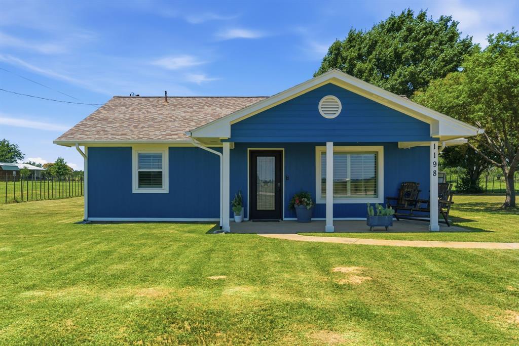 Enjoy peaceful country living on .59 acres in Millsap, TX in this charming farmhouse! Recently updated and move-in ready, this home offers 3 bedrooms, 2 bathrooms, and a spacious layout that feels welcoming from the moment you walk through the door. The large living area provides plenty of room for gathering, while custom trim work found throughout the home adds character and craftsmanship. The farmhouse kitchen features custom cabinetry, abundant storage, and great prep counterspace. Just beyond, the enormous dining room creates the perfect setting for family dinners, holiday celebrations, and entertaining guests. The primary suite is generously sized and features an ensuite bath with dual vanities, a large walk-in shower, and ample closet space. A brand-new laundry room features custom cabinetry and a new wash and dry appliance. This property is meticulously maintained. Whether you're enjoying a quiet morning on the front porch or unwinding in the evening on the back porch, you'll appreciate the peaceful setting, large yard, beautiful trees, and scenic ranch views that surround the property with wide-open Texas skies. The oversized two-car garage provides plenty of space for vehicles, tools, and hobbies. With no restrictions, recent updates, and room to enjoy the outdoors, this property offers the freedom and simplicity of country living while remaining closely convenient to Weatherford and Interstate 20.