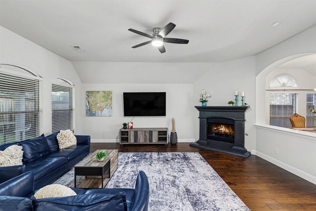 Welcome to this beautifully designed single-story home in the highly sought-after Briarwyck community in Roanoke, TX. Offering 4 bedrooms, 2.5 baths, and a functional open-concept layout, this home is perfectly suited for modern living. From the moment you step inside, you’ll notice rich wood flooring, custom lighting, and expansive living spaces that create a warm yet elevated feel—ideal for both everyday living and entertaining. Fresh paint and new carpet in all bedrooms add a clean, move-in ready appeal.

The chef-inspired kitchen is the heart of the home, seamlessly opening to the main living area for easy flow and connection. A dedicated dining space is perfect for gatherings, while a built-in desk or workspace in the main living area adds everyday functionality—ideal for working from home, homework stations, or managing busy schedules.

The thoughtfully designed floor plan balances open living with private retreats. The spacious primary suite offers dual closets and a generously sized ensuite bath designed for relaxation. A dedicated media room provides flexible space for movie nights, game days, a playroom, or even a private office.

Situated on a private lot with no back neighbors, this home offers rare peace and privacy while remaining conveniently located near shopping, dining, Texas Motor Speedway, and DFW International Airport. Zoned to highly rated Northwest ISD.

Residents of Briarwyck enjoy resort-style amenities including a community pool, playground, and scenic walking trails. Just minutes away, experience Roanoke—known as the Dining Capital of Texas—with award-winning restaurants, local events, live music, and year-round entertainment. Enjoy a charming small-town feel with easy access to both Dallas and Fort Worth.

This home offers the perfect blend of single-story convenience, thoughtful design, and lifestyle in North Texas—don’t miss your opportunity to make it yours!