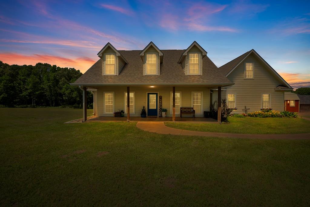 Welcome to this beautifully designed farmhouse-style home situated on 1.8 acres in the sought-after Spring Creek Addition. This 3-bedroom, 2-bath home offers nearly 2,000 square feet of comfortable, single-level living with a perfect blend of rustic charm and modern features.

Inside, you’ll find an inviting open-concept layout with a vaulted ceiling and cozy wood-burning fireplace, ideal for relaxing or entertaining. The kitchen flows seamlessly into a bright breakfast area filled with natural light from surrounding windows.

The spacious primary suite features a sliding barn door, double vanity, soaking tub, separate shower, and two separate closets, creating a private retreat. A versatile flex room provides options for a home office, dining room, or additional living space.

Step outside to enjoy peaceful country living with a covered front porch, large back deck, and fenced acreage—perfect for pets, gatherings, or simply enjoying the outdoors.

Located just minutes from downtown Emory with convenient access to major highways, this home offers the ideal balance of privacy and accessibility.