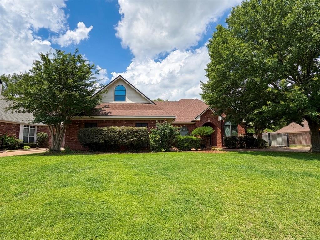 Welcome to this spacious 2-story, 5-bedroom, 4-bathroom single-family home located in the desirable, gated community of Brunswick Place! Offering 2,665 square feet of perfectly organized living space, this beautiful brick property seamlessly blends extensive room for your family with optimal city convenience. Pull up to excellent curb appeal highlighted by an inviting arched entry porch, a long concrete driveway, and an attached 2-car garage. Step inside to discover a bright interior packed with upscale architectural details, including custom crown molding, elegant ceiling treatments, a formal dining area, and a large living room anchored by a versatile fireplace. The kitchen is fully equipped with a gas range, cooktop, microwave, and built-in dishwasher. The layout provides ample space and privacy for family and guests alike, featuring cozy wood, ceramic tile, and plush carpet flooring throughout. The generous primary suite serves as a true retreat, connecting to an expansive bathroom with a double vanity, jetted tub, and separate shower stall. Upstairs, the property features a massive bonus space with beautiful vaulted ceilings. Step out back to find your private oasis, complete with a fully fenced backyard and an extended covered concrete patio perfect for evening relaxation. Schedule your showing today before this Shreveport gem is gone!